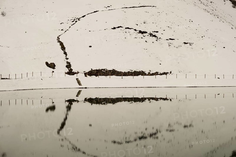 Another onset of winter in May, Riezler Alpsee, an artificially created lake, snow pond, feeds the snow cannons that completely snow the slopes of the Fellhorn and Kanzelwand cable cars, Allgäu Alps, Vorarlberg, Austria