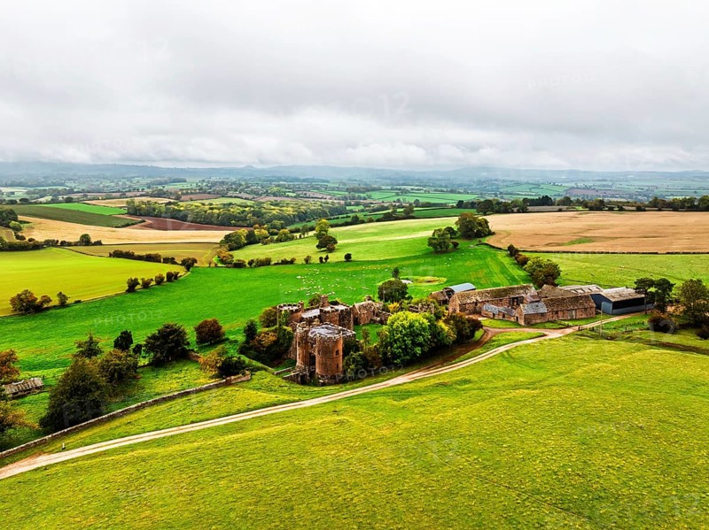 Autumn Colours over ruins of Pembridge Castle or Newland Castle from a drone, Herefordshire, England, United Kingdom