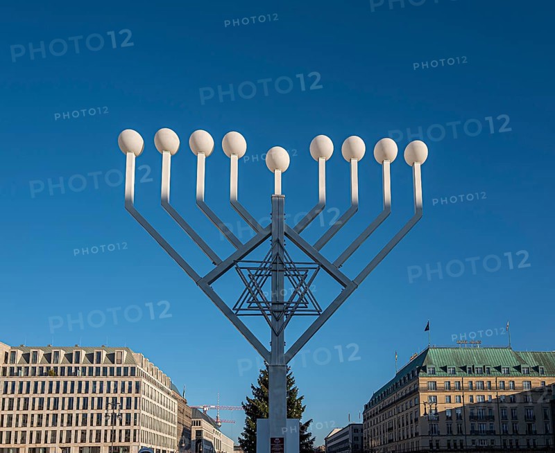 Large Hanukkah chandelier at the Brandenburg Gate in daylight, sign of lively Jewish life, symbolic power for 20 years, Berlin, Germany