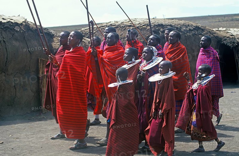 Maasai men and girls in their village in the Ngorongoro Crater dancing for tourists, Tanzania, Africa, June 2000, vintage, retro, old, historic