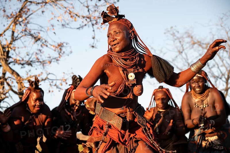 Himba woman dancing euphorically, traditional dance, traditional Himba village, Kaokoveld, Kunene, Namibia