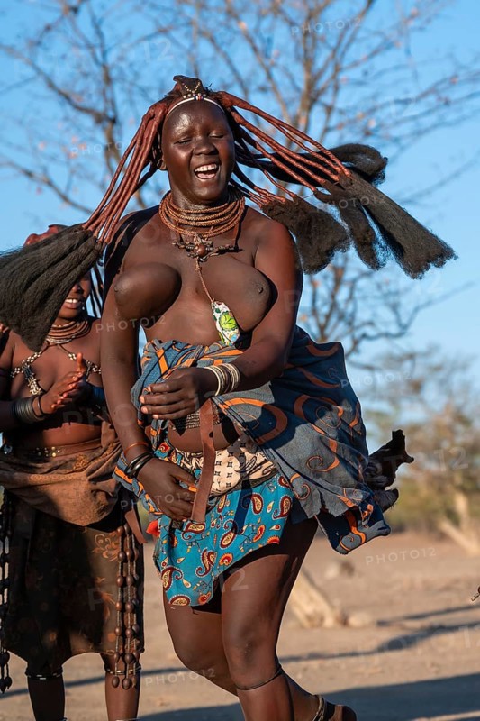 Himba woman dancing euphorically, traditional dance, traditional Himba village, Kaokoveld, Kunene, Namibia