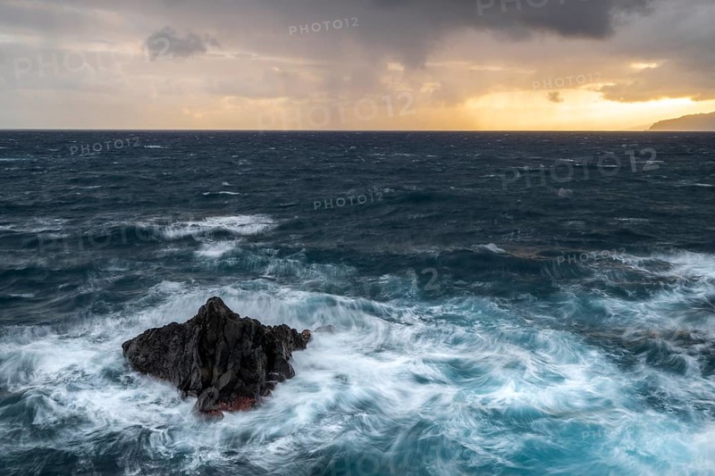 Sunrise, waves and rocks, coast near Porto Moniz, Madeira, Portugal