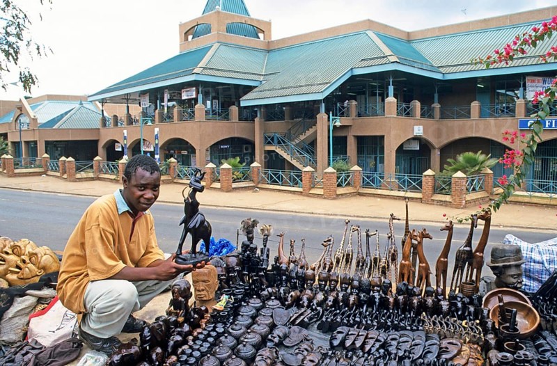 Artist, woodcarving stand at Lilongwe market, Malawi, Africa, June 2000, vintage, retro, old, historic