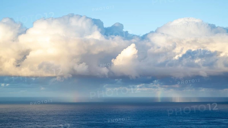 Rainbow over sea, dark rain cloud, rain, Madeira, Portugal