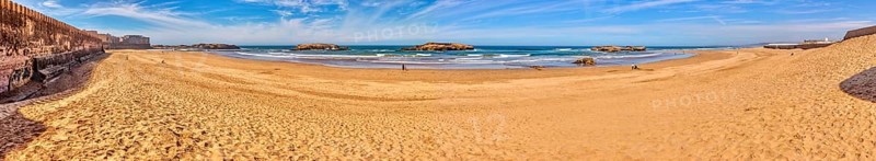 Extensive sandy beach with calm sea and clear sky, Morocco, Essaouira, coast, panorama