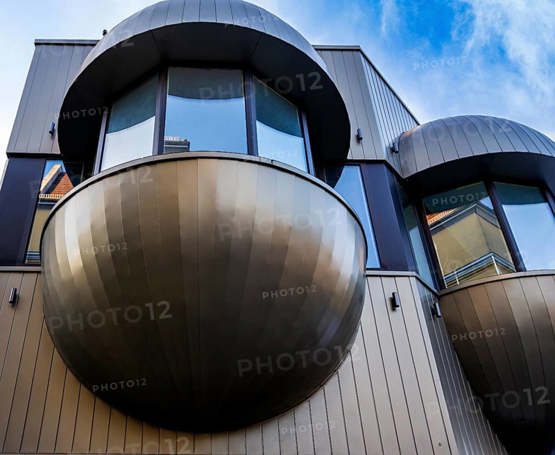 Futuristic balconies with bay windows on a prefabricated building from the sixties in Nikolaiviertel, Berlin, Germany