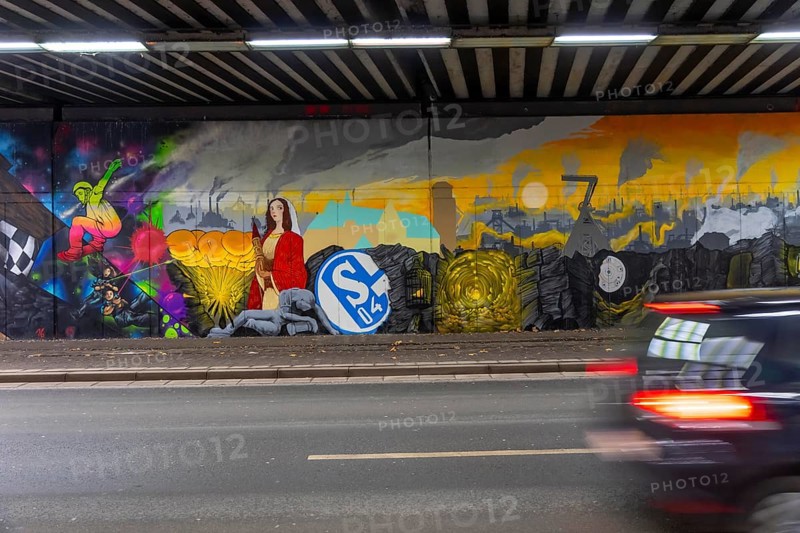 Huge street art pictures in a road tunnel in Gelsenkirchen, the approximately 120 meter long railway underpass of Wickingstraße was extensively painted and sprayed on both sides by 11 Gelsenkirchen graffiti artists and collectives, over a total length of 174 meters, the wall paintings showed motifs from Gelsenkirchen history, from economy, coal, steel, soccer, Schalke 04, culture, life, to the 150.year-old city Anniversary on 29.11.25, North Rhine-Westphalia, Germany