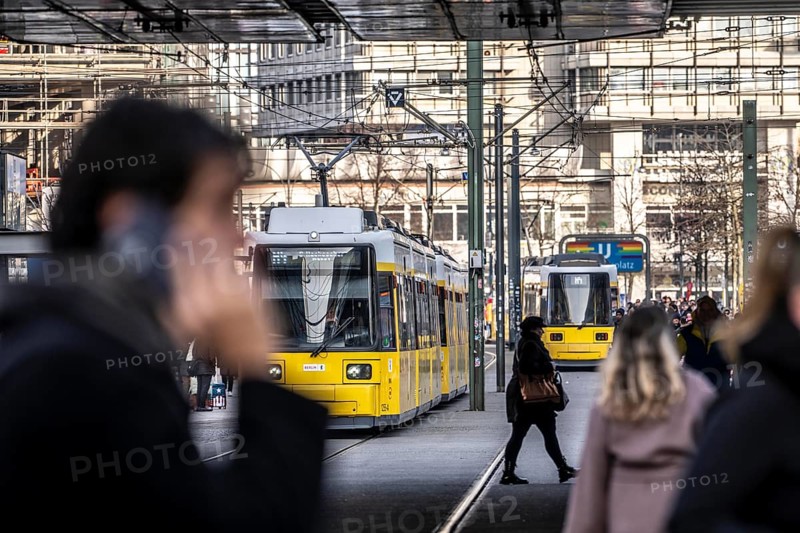 Trams at Alexanderplatz in Berlin, passers-by, Germany