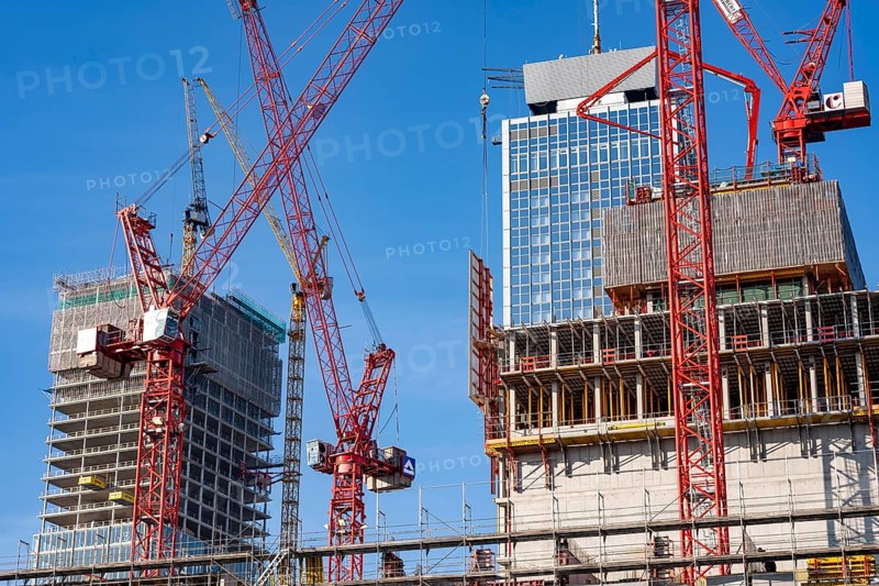 Construction site of the Covivio skyscraper in front, in the vicinity of Alexanderplatz in Berlin, mixed use of apartment, offices, retail and a daycare center, the high-rise construction site of The Berlinian office high-rise building in the back, Germany