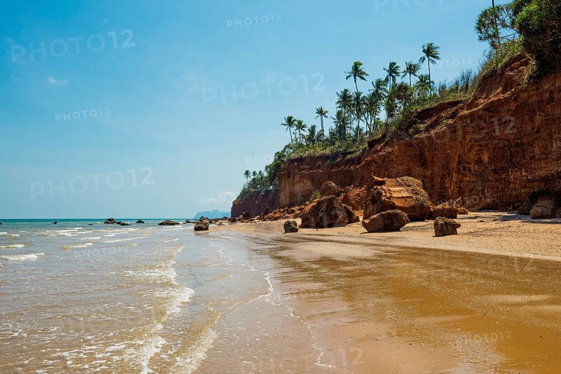 Lonely beach with red rocks and coconut trees, Red Cliffs, Bang Saphan Noi, Prachuap Khiri Khan Province, Central Thailand, Thailand