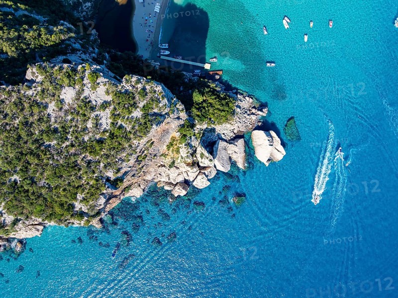 Picturesque rocky coast, cliffs and Cala Luna beach, aerial view, top-down, Golfo di Orosei, Baunei, Sardinia, Italy