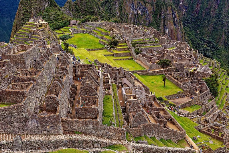 Rocky ruins and expansive terraces in an ancient setting, the ruins of the Inca city of Machu Picchu in Peru
