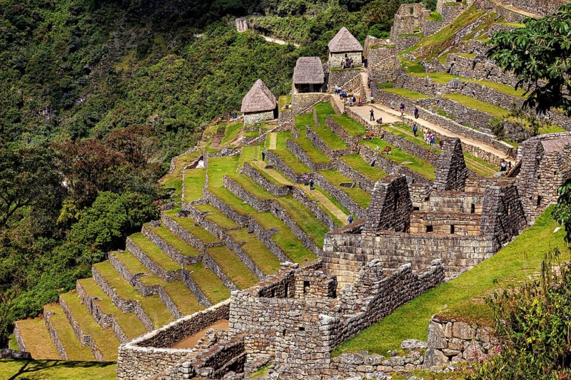 Historic Inca ruins with well-preserved terraces and huts, The ruins of the Inca city of Machu Picchu in Peru