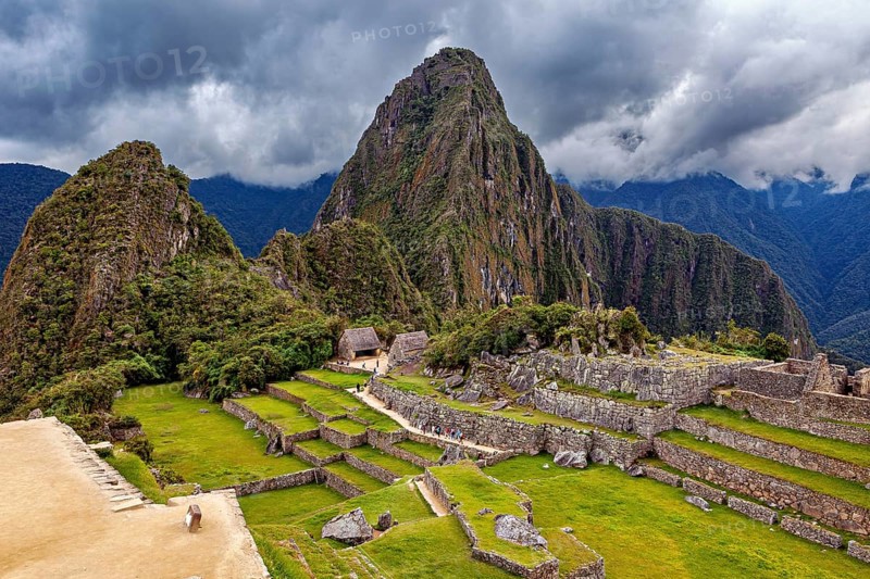 Ruins of Machu Picchu with dramatic skies and thick forests, The ruins of the Inca city of Machu Picchu in Peru