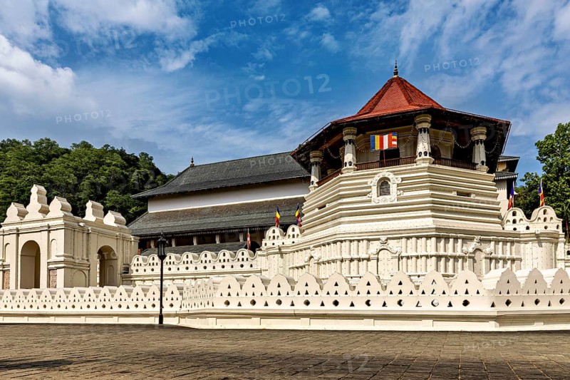 -View of a majestic historic building under a blue sky, The Temple of the Tooth in Kandy Sri Lanka