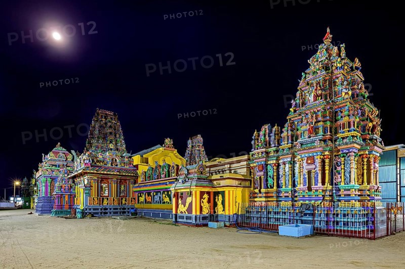Colourful temples at night in moonlight with artfully designed reliefs, The Sri Pathrakali Amman Trincomalee in Sri Lanka