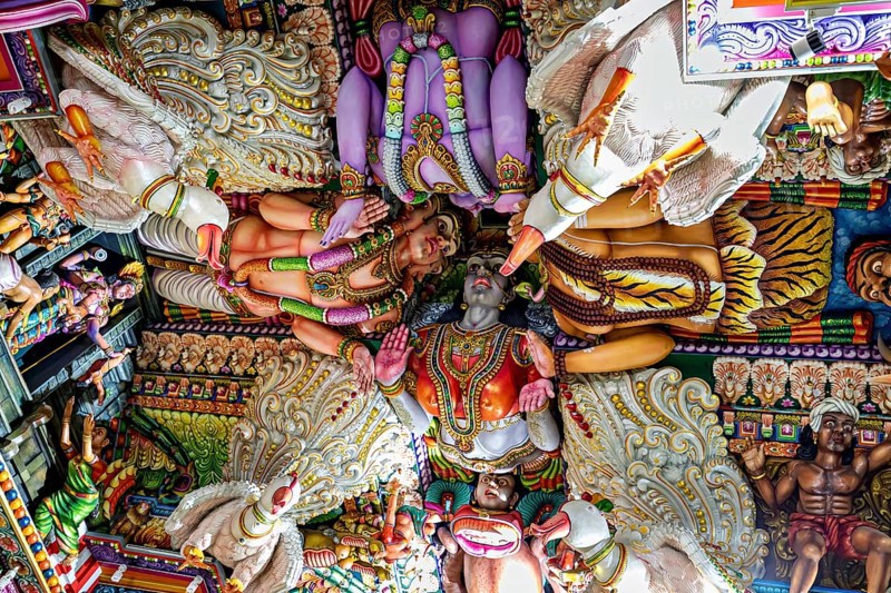 Detailed ceiling painting in a temple with bright colors and Hindu figures, The Sri Pathrakali Amman Trincomalee in Sri Lanka