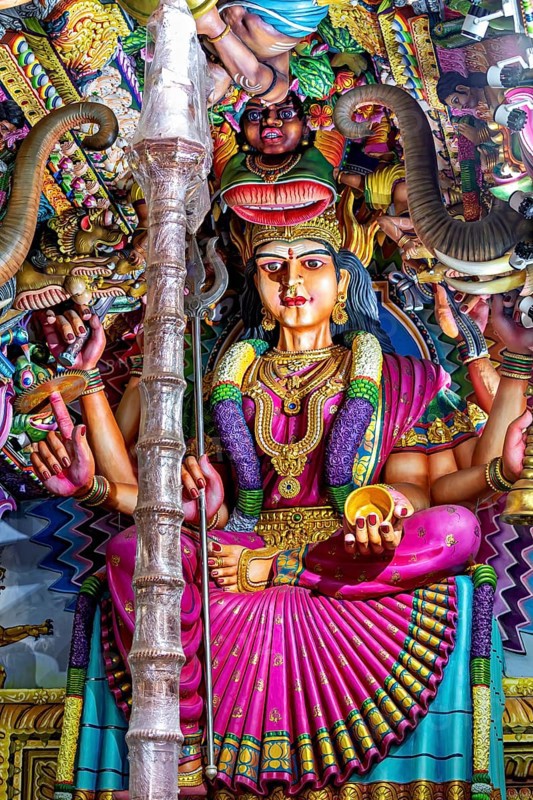 Magnificent sculpture of a goddess in a temple surrounded by detailed decorations, The Sri Pathrakali Amman Trincomalee in Sri Lanka