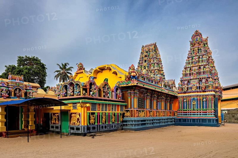Hindu temple with colorful sculptures and traditional architecture under clear skies, The Sri Pathrakali Amman Trincomalee in Sri Lanka