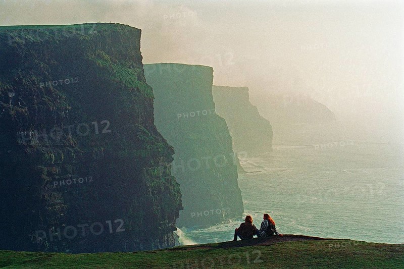 People on the edge of a cliff, there was no fence back then, Cliffs of Moher, County Clare, Republic of Ireland, April 9, 1995, vintage, retro, old, historic