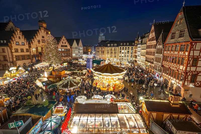 With the lighting on the Mrs. Holle Christmas tree, a 30-meter high Nordmann fir tree, the Frankfurt Christmas Market was officially opened on 24.11.2025. The Christmas market will be open until December 22 from Monday to Saturday from 10:00 to 21:00 and on Sundays from 11:00 to 21:00, Römerberg, Frankfurt am Main, Hesse, Germany
