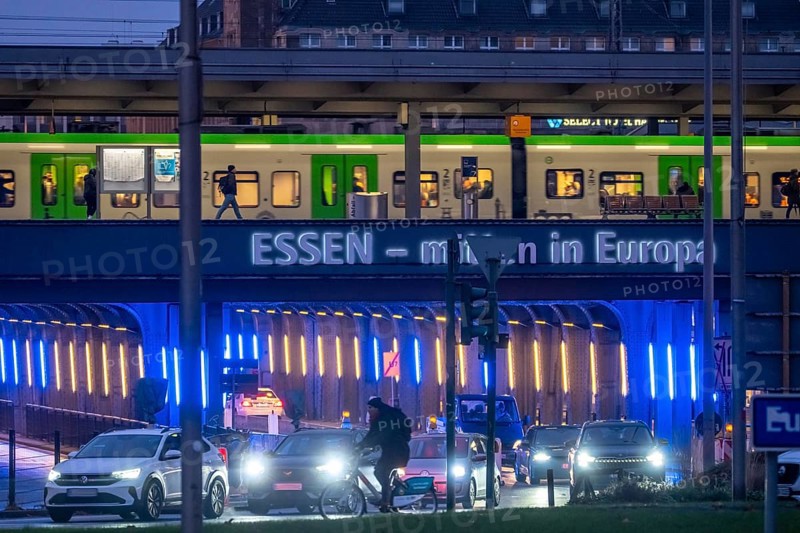 The main train station in Essen, blue-lit underpass, bus station, am Europaplatz, public transport train on the platform, North Rhine-Westphalia, Germany