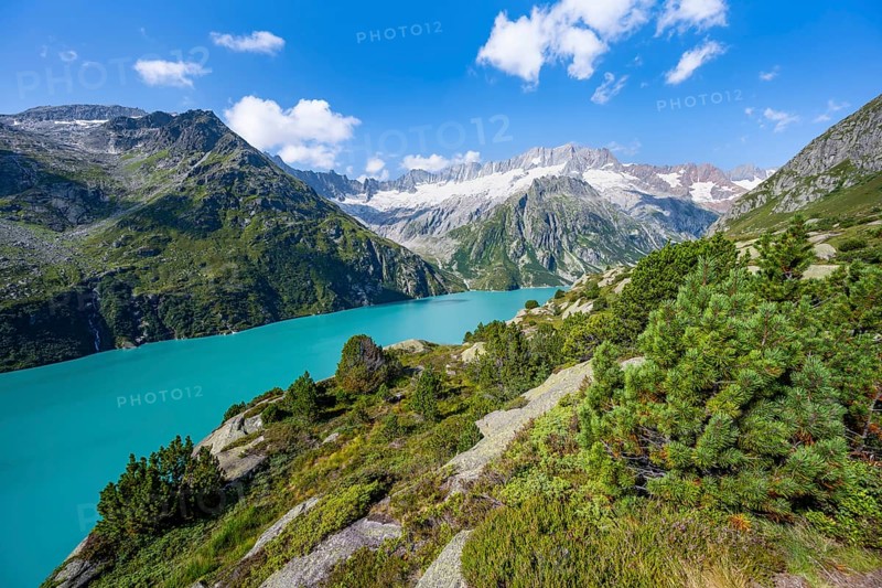 Turquoise blue mountain lake Göscheneralpsee, picturesque mountain landscape with dammastock and damma glacier, Göscheneralp, Canton of Uri, Switzerland