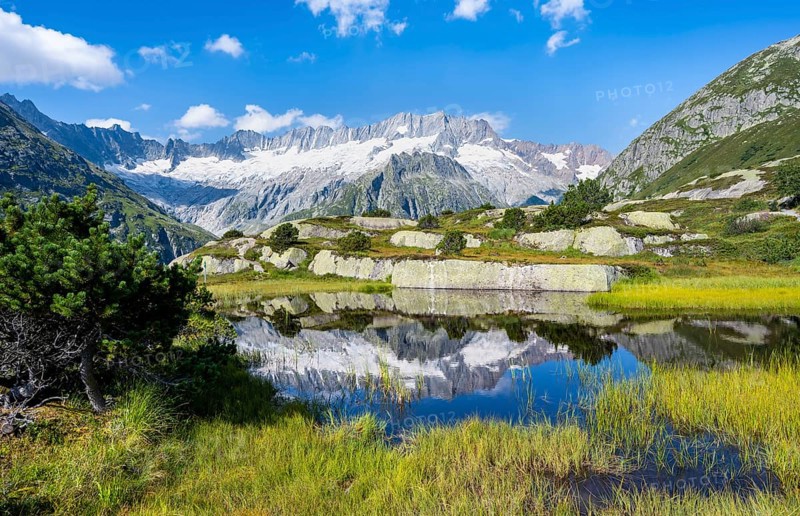 Picturesque mountain landscape, dammastock and damma glaciers reflected in Moorsee, Göscheneralp, Canton of Uri, Switzerland