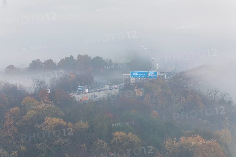 Aichelberg Alb climb of the A8 in thick fog on an autumn morning. Lkr. Göppingen, Baden-Württemberg, Germany
