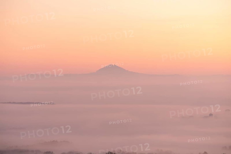 Hohenstaufen in the golden morning light, Aichelberg. Spectacular dawn over the foggy foothills of Alb