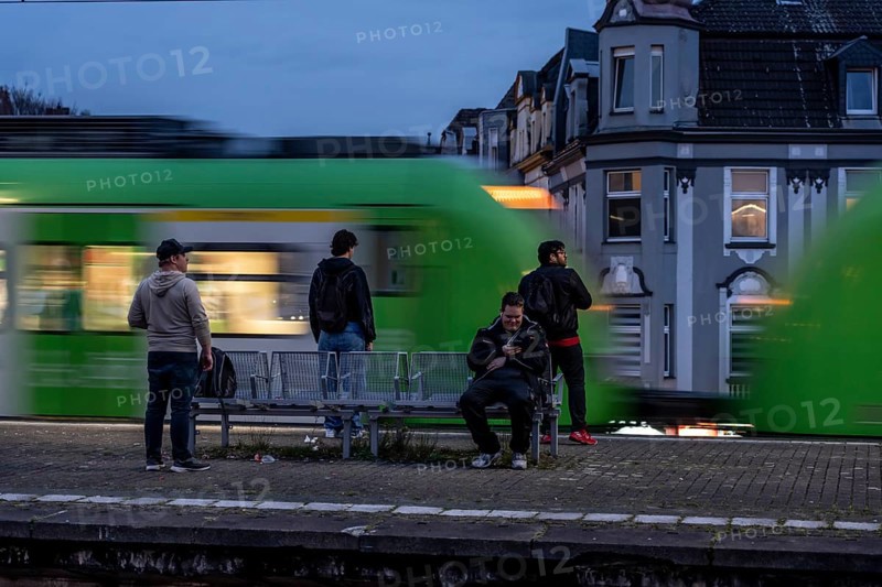 Essen-Steele S-Bahn station, passengers waiting for the train late afternoon, in autumn, Essen, North Rhine-Westphalia, Germany