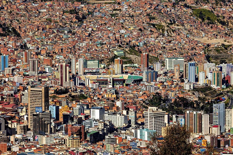 View of a dense urban landscape with many skyscrapers and mountains in the background, The city of La Paz in Bolivia