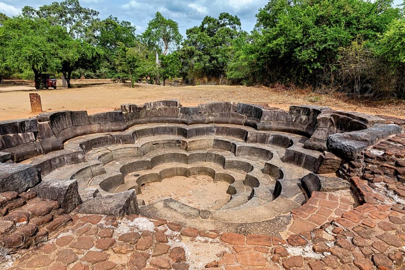 Stone-shaped concentric water basin in ancient style surrounded by trees, The temples of Polonnaruwa in Sri Lanka
