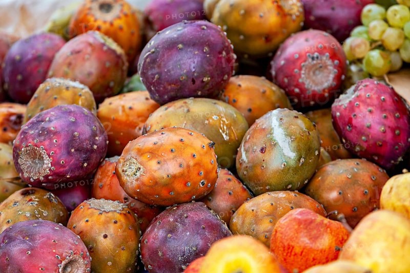A close-up of colorful prickly pears in a market that radiate diversity and vibrancy, The fruits are prickly pears (fruits of the prickly pear cactus, Opuntia ficus-indica)