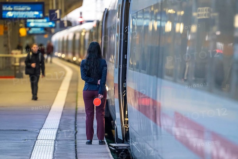 ICE train ready for departure, train staff waiting for the signal to continue, at Essen main station, on the platform, North Rhine-Westphalia, Germany
