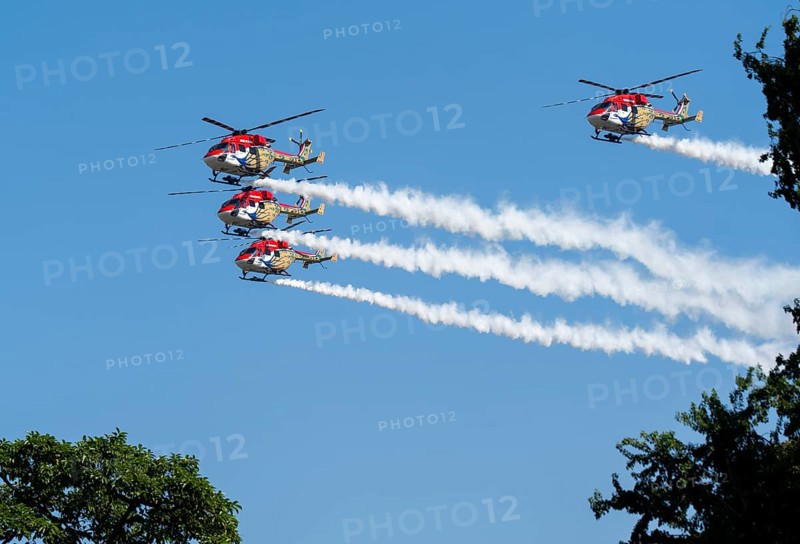 Indian Air Force (IAF) ALH Mk1 Sarang helicopters soar through the sky during an air show as part of the 93rd Air Force Day celebrations on November 8, 2025 in Guwahati, India
