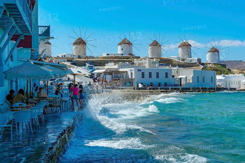 Mykonos, Cyclades, Greece - The six sixteenth-century windmills, lined up on a hill above Mykonos Town, Mykonos Chora, are the island's landmark. Mykonos is part of the Cyclades archipelago in the Aegean Sea