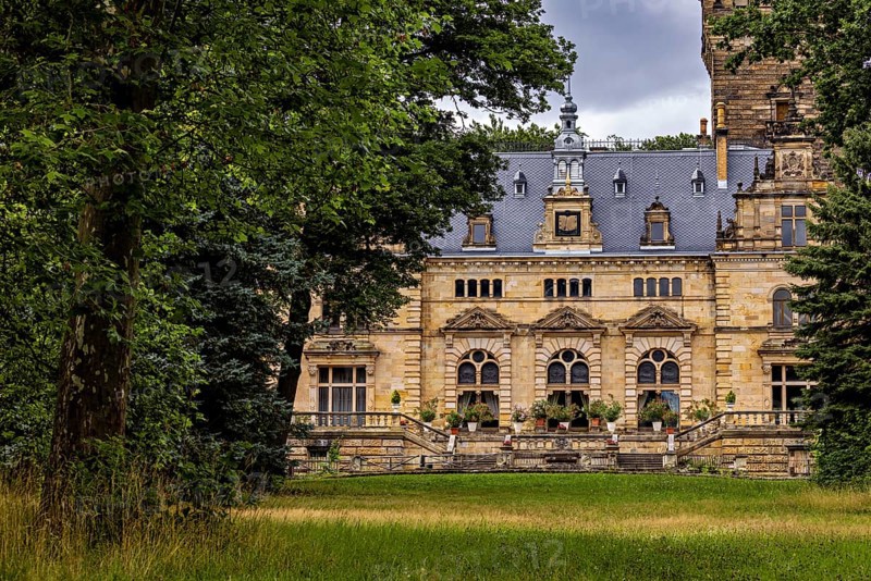 Historic castle surrounded by lush nature and cloudy skies, The Hummelshain hunting lodge in Thuringia