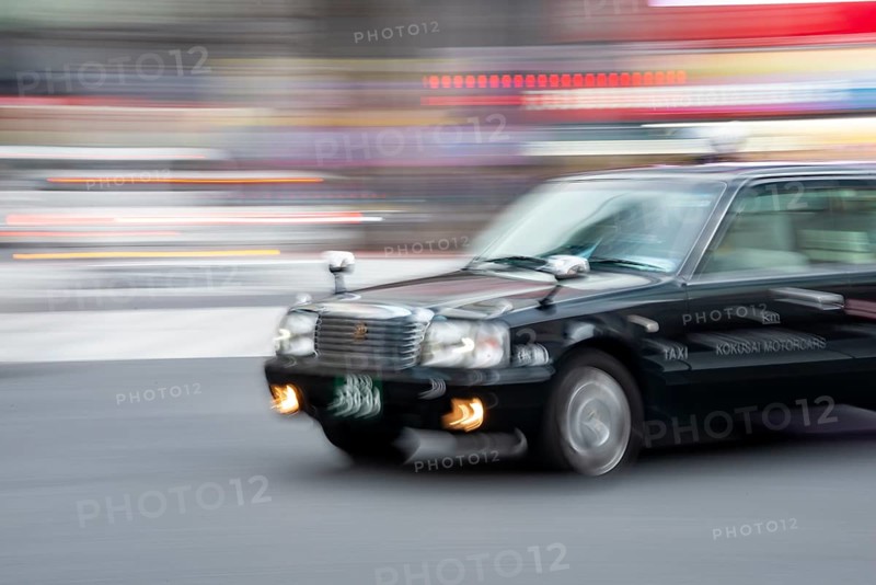 Black taxi driving, motion blur, long exposure, Shubuya Crossing, Shibuya, Tokyo, Japan