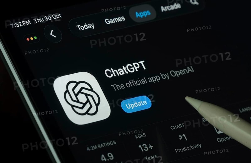 Dhaka, Bangladesh- 30 Oct 2025: ChatGPT app displayed on a iPad screen in dark mode with a digital pen pointing at it