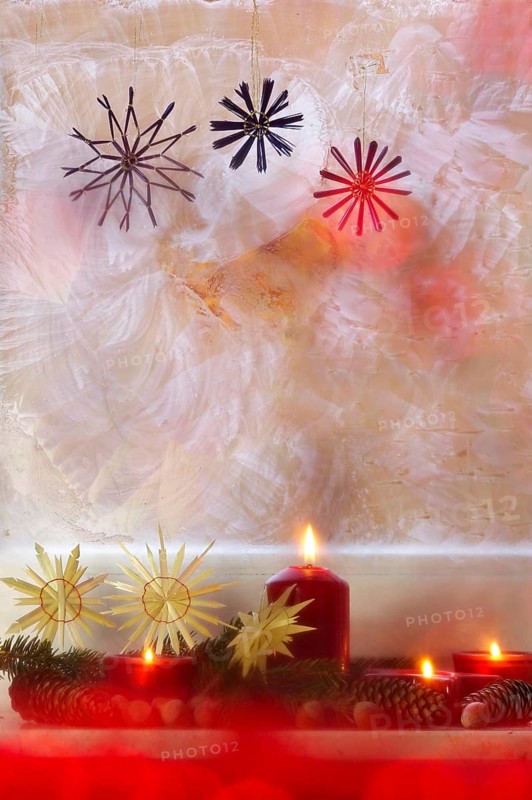 Christmassy decorated iced window, candle light, straw stars, Germany
