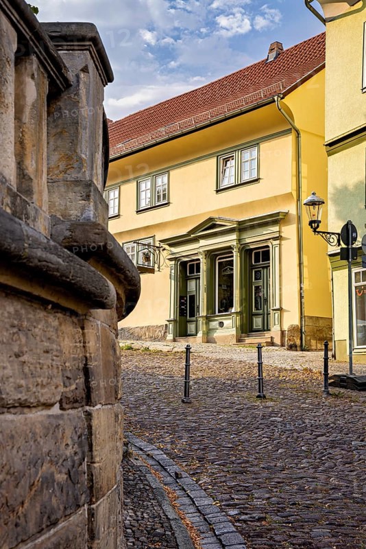 Yellow historic building on a paved street with classic architecture, The old town of Arnstadt in Thuringia