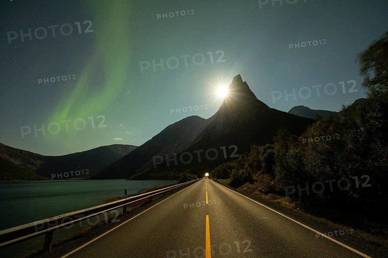 National mountain of Norway - Stetind in the Nordland under auroras and a full moon