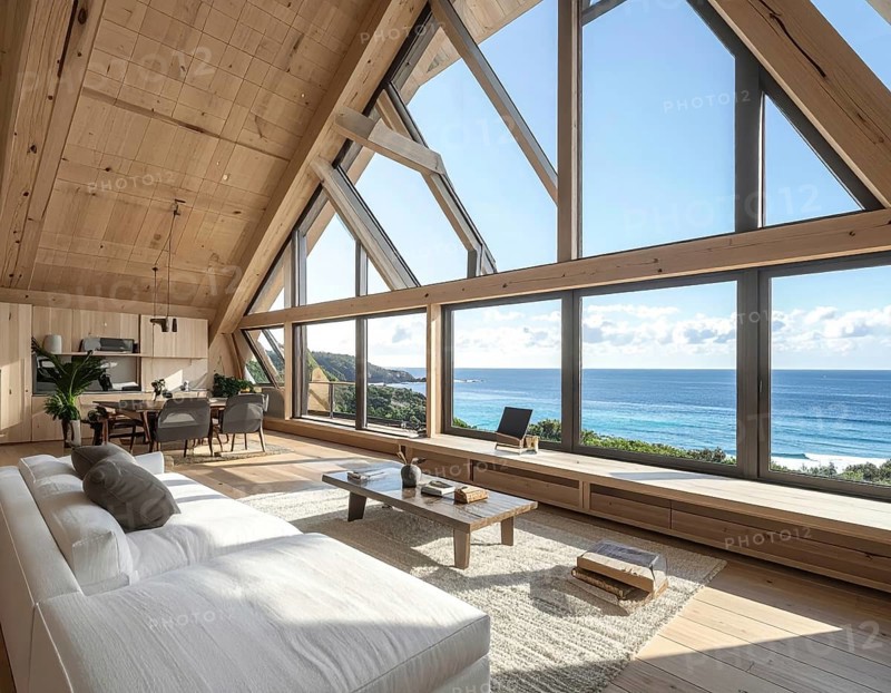 Peaceful A-frame cabin interior with ocean views, real estate lifestyle and travel destination, Comfortable minimalist sanctuary embraced by natural beauty and stunning coastal scenery, clear blue sky, AI generated