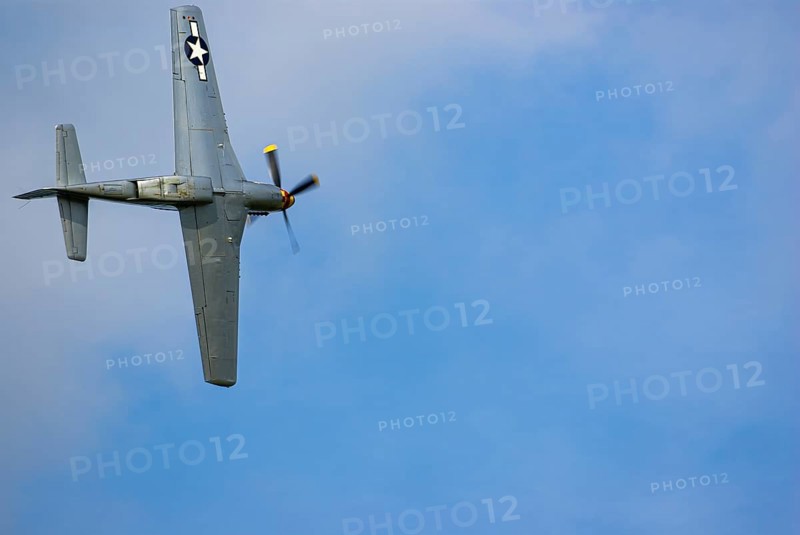 A North American P-51 Mustang of the flying group Flying Bulls, the Nooky Booky IV during an air show at the Rossfeld in Metzingen-Glems, Baden-Württemberg, Germany, for editorial use only