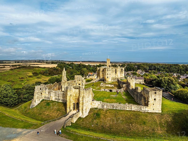Warkworth Castle over River Coquet from a drone, Warkworth, Northumberland, England, United Kingdom