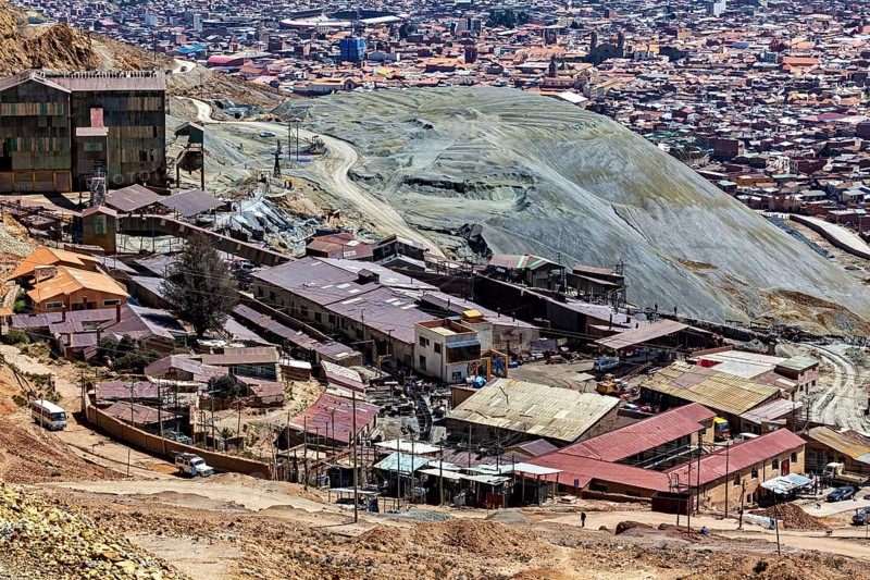 Extensive settlement area with industrial buildings in a barren hilly landscape, The silver mines of the Cerro Rico silver mountain near Potosi in Bolivia