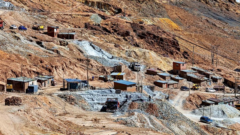 Spacious settlement with huts and vehicles in a barren, stony terrain, The silver mines of Potosi Bolivia