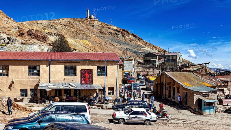 Busy square in front of a mine site with people and cars, The silver mines of Potosi Bolivia
